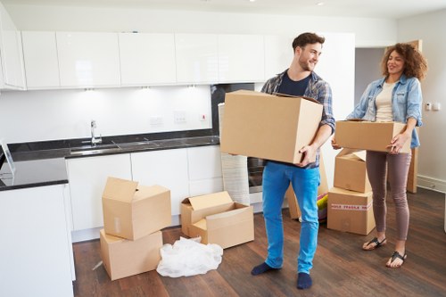 Packed moving boxes and furniture ready for removals in Colyers