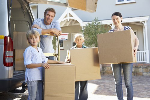 Professional house removals team loading furniture for a Colyers home move
