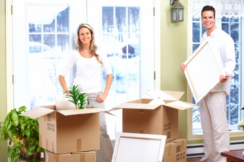 Packing team organizing boxes and materials in Colyers